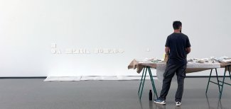 Student on a traineeship working on an exhibition space